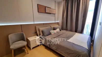 Modern bedroom with stylish decor and natural light