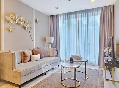 Elegant living room with modern decor and large window for natural light