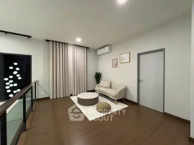 Modern living room with elegant decor and balcony view