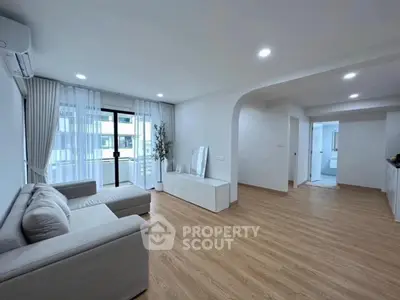 Spacious modern living room with natural light and elegant decor
