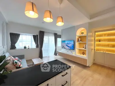 Modern living room with stylish lighting and built-in TV unit