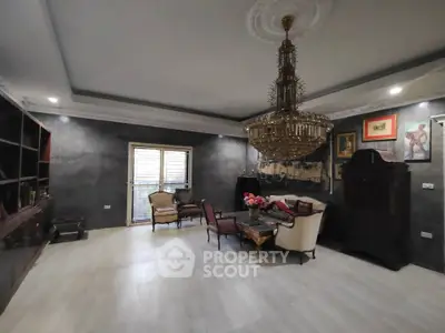 Luxurious living room with elegant chandelier and classic furniture