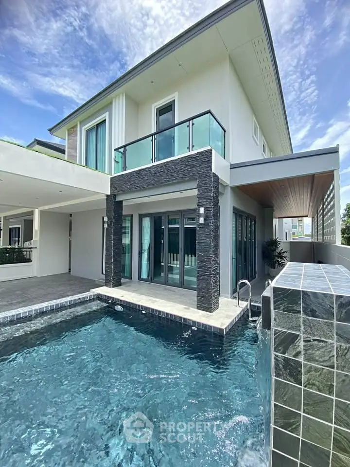 Modern luxury home with private pool and elegant balcony, perfect for upscale living.