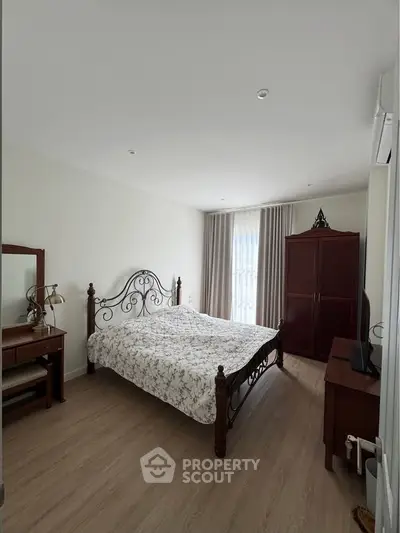 Charming bedroom with elegant wooden furniture and natural light