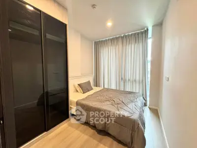 Modern bedroom with sleek wardrobe and cozy bed in a stylish apartment