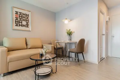 Modern living room with stylish decor and cozy seating area in a contemporary apartment.