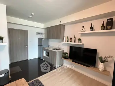 Modern kitchen with sleek cabinetry and integrated appliances in stylish apartment