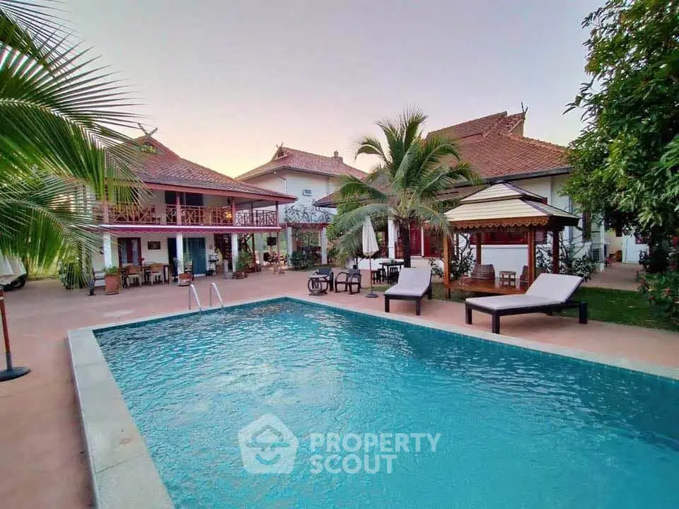 Luxurious villa with private pool and lush garden, perfect for relaxation and entertaining.