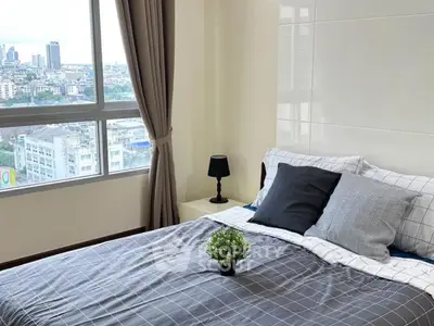 Bright and cozy bedroom with city view, featuring stylish decor and large window.