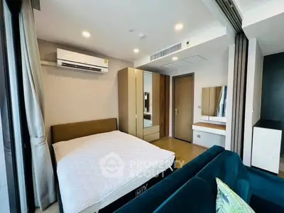 Modern bedroom with air conditioning and stylish decor in a contemporary apartment.