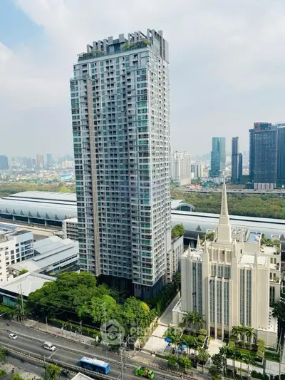 Stunning high-rise building with panoramic city views and lush greenery, perfect for urban living.