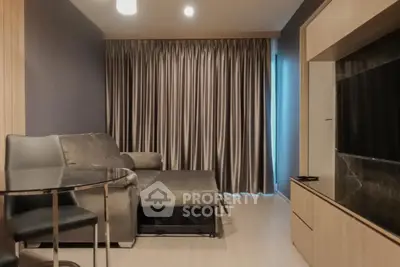 Modern living room with sleek furniture and elegant curtains