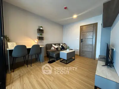 Modern living room with stylish furniture and wooden flooring