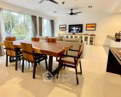 Spacious modern living room with elegant dining area and large windows