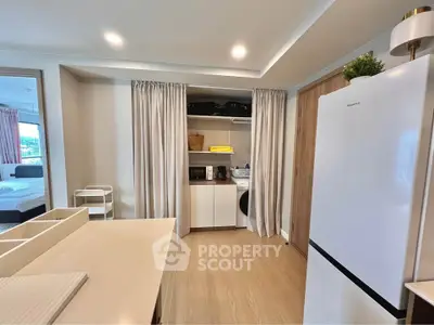 Modern kitchen with sleek appliances and open layout in a stylish apartment