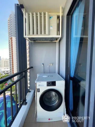 Modern balcony with washing machine and city view, perfect for urban living convenience.