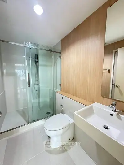 Modern bathroom with glass shower and sleek fixtures