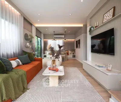 Modern living room with stylish decor, large windows, and open layout for a cozy ambiance.