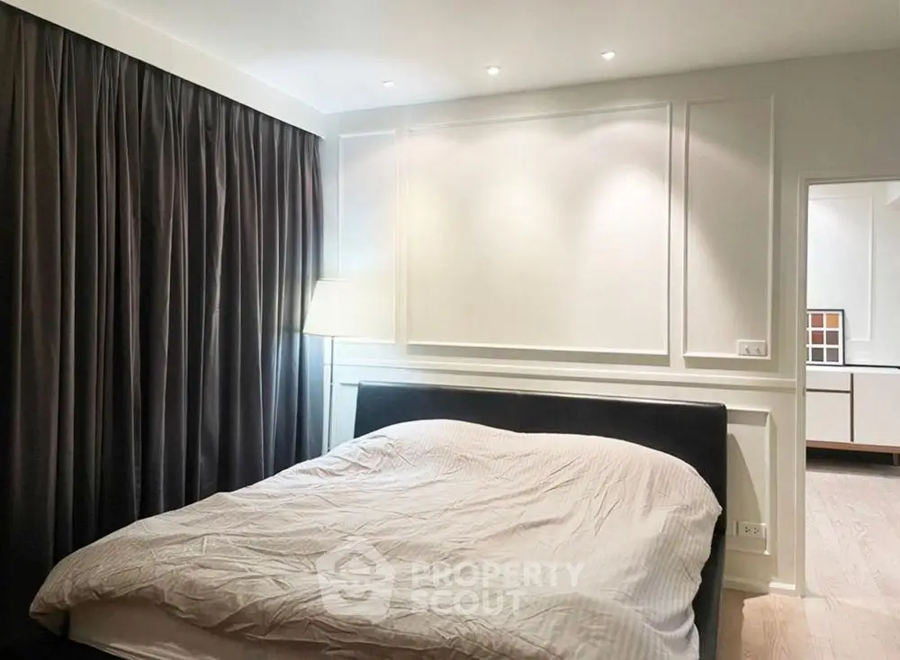 Cozy bedroom with elegant lighting and modern decor