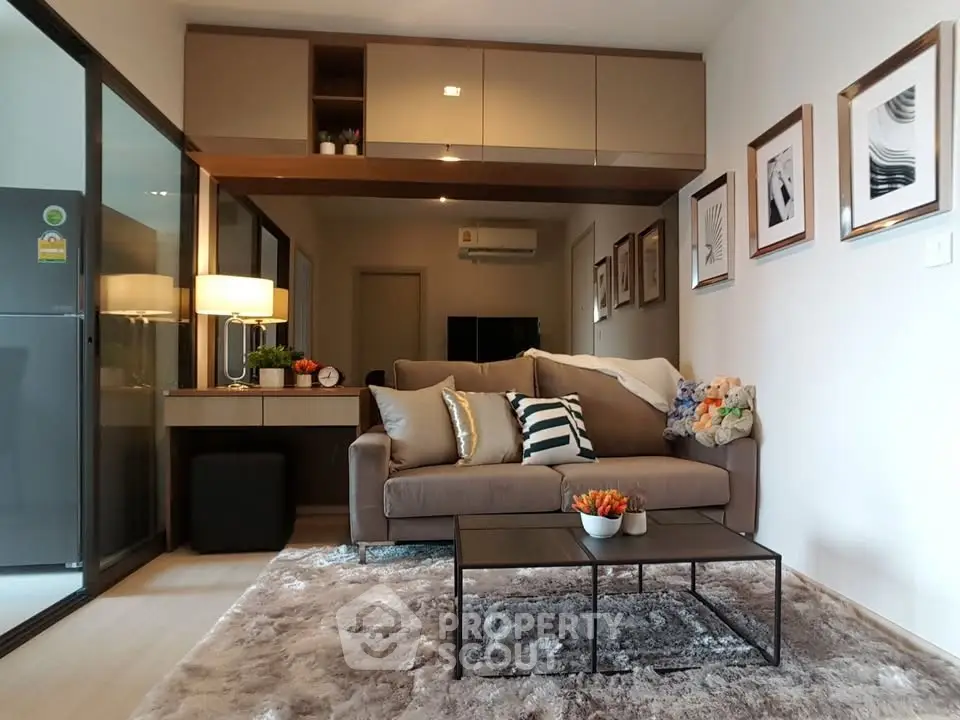 Modern living room with stylish decor and cozy seating in a contemporary apartment.