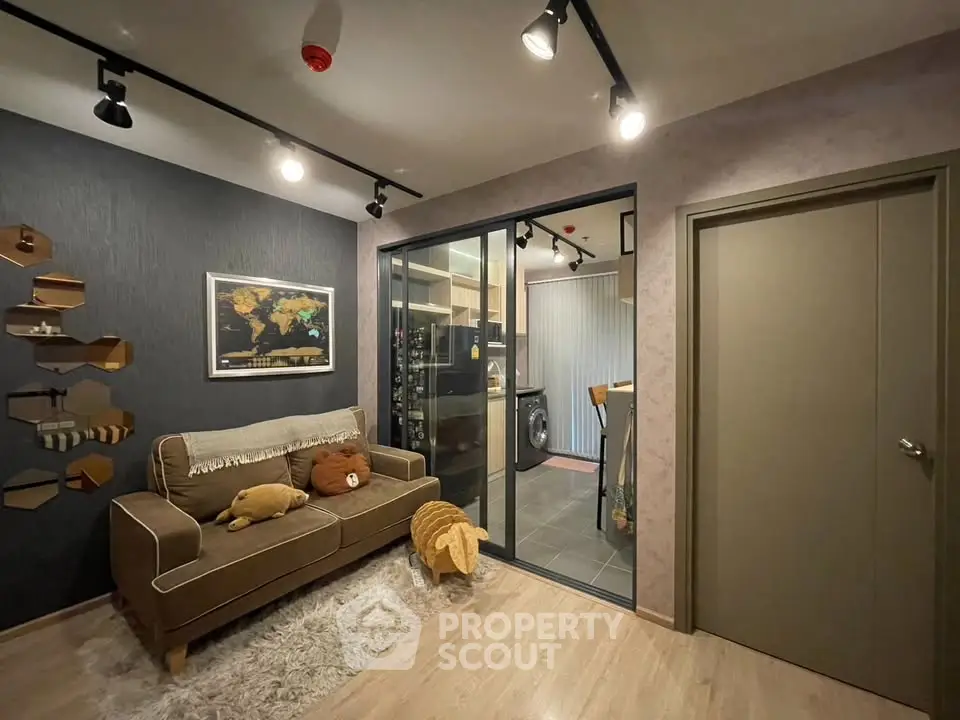 Cozy living room with modern decor and adjacent kitchen view