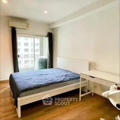 Modern bedroom with balcony view and minimalist furniture