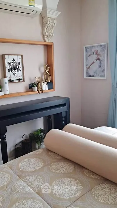 Cozy bedroom with elegant decor and soft lighting, featuring a stylish wall shelf and decorative art pieces.