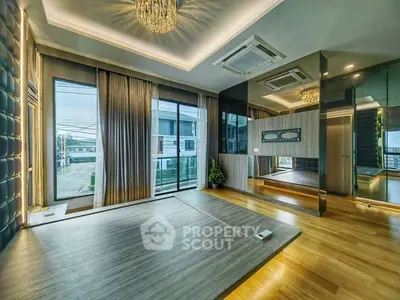 Luxurious modern bedroom with floor-to-ceiling windows and elegant lighting.