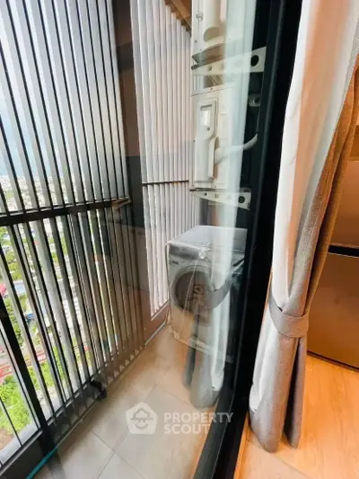 Modern balcony with city view and compact laundry area