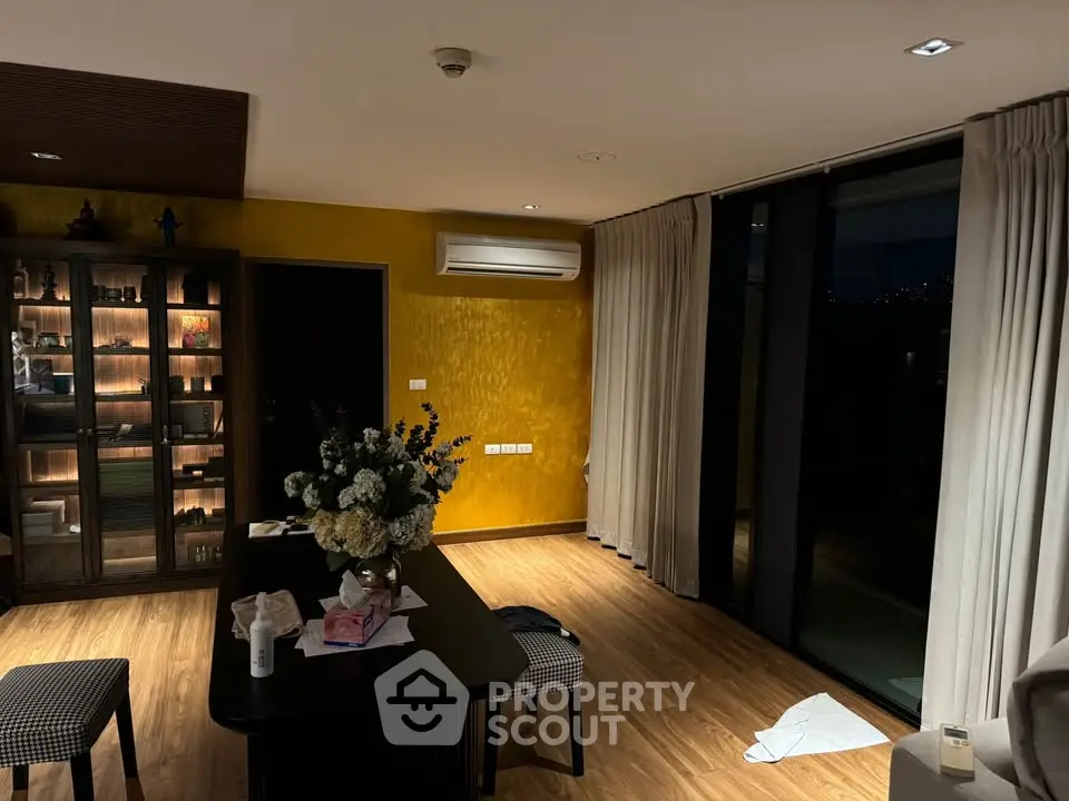 Elegant dining area with modern decor and large windows for natural light.