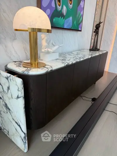 Elegant modern living room with marble sideboard and artistic decor