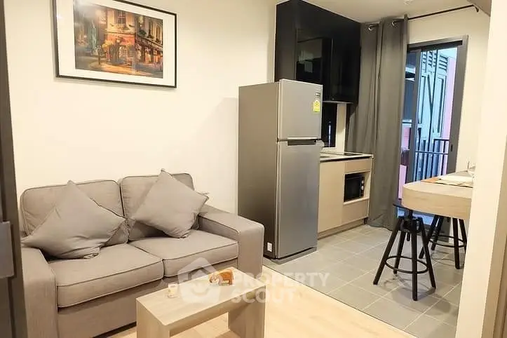 Modern apartment interior with cozy living area and compact kitchen