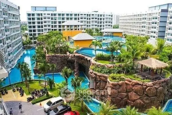 Luxurious resort-style apartment complex with stunning pool and lush greenery.