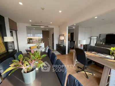 Modern open-plan living and dining area with stylish decor and natural light