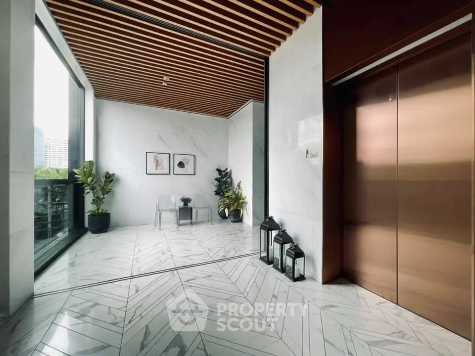 Luxurious modern building entrance with elegant elevator and stylish decor