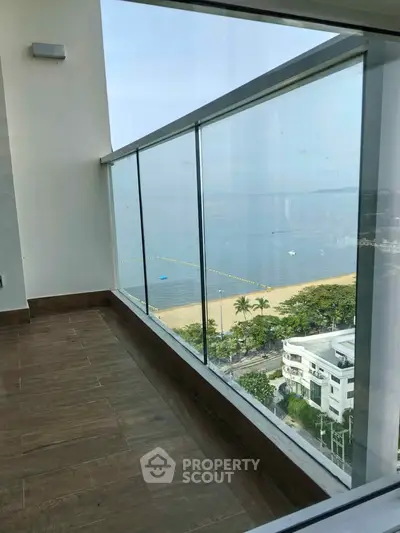 Stunning beachfront balcony with panoramic ocean views, perfect for relaxation and enjoying the coastal breeze.