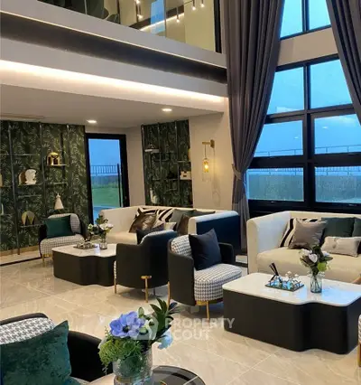 Luxurious modern living room with high ceilings and elegant decor