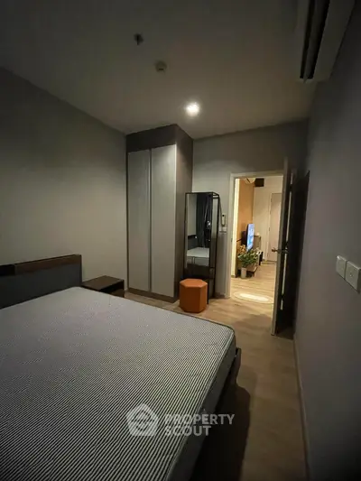 Cozy bedroom with modern decor and ample storage space