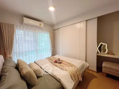 Cozy bedroom with large window and elegant decor in modern apartment