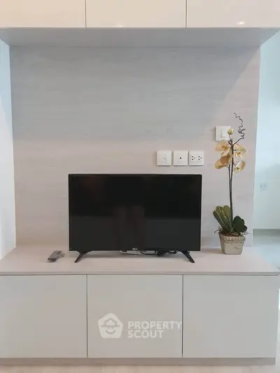 Modern living room with sleek TV setup and elegant decor