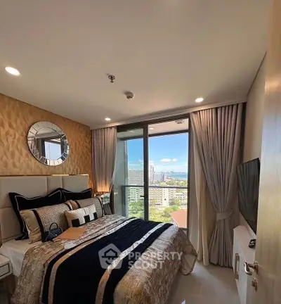 Luxurious bedroom with city view, elegant decor, and modern furnishings.
