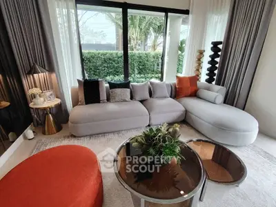 Stylish modern living room with large windows and chic furniture