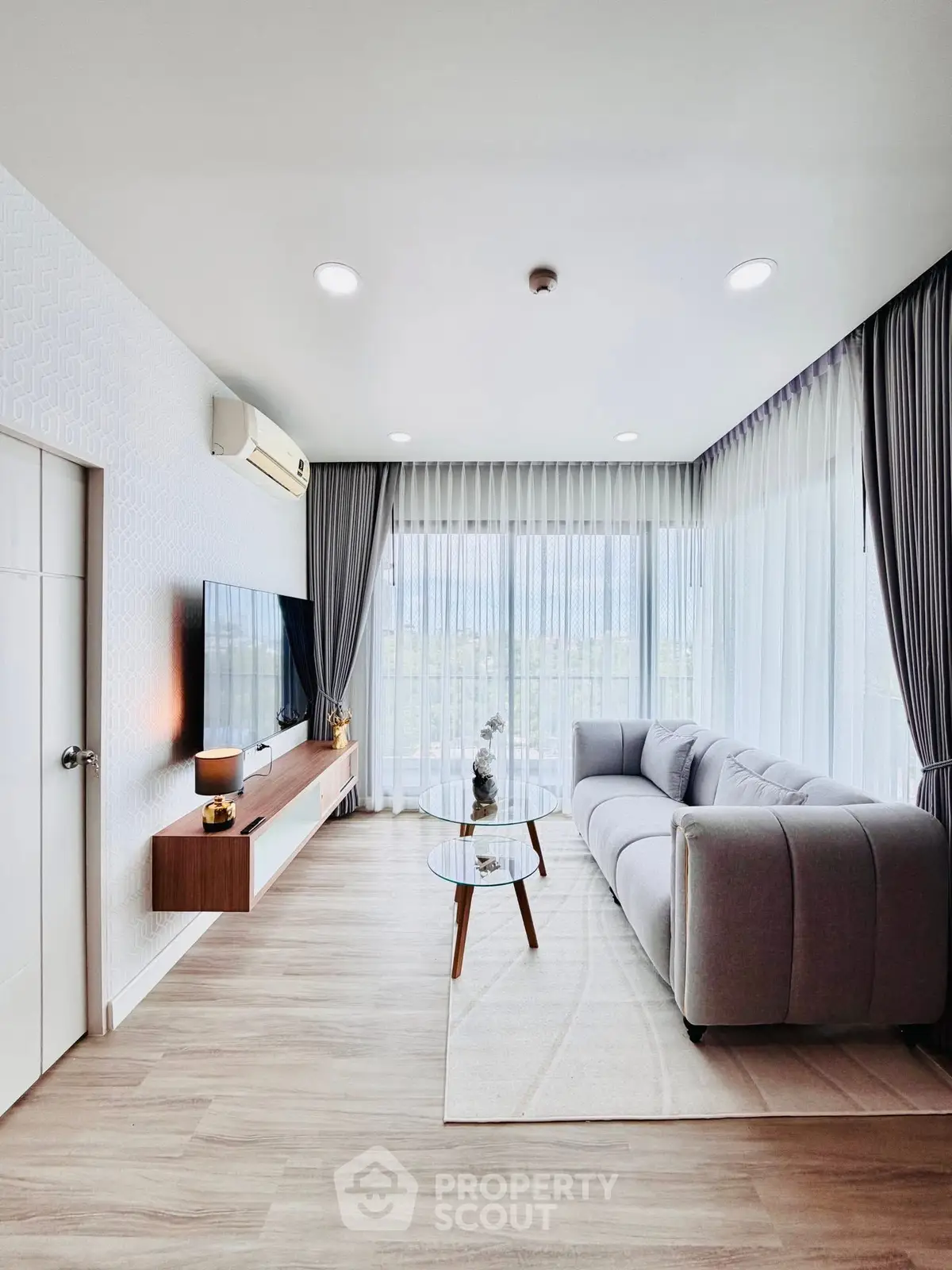 Modern living room with large windows and stylish furniture