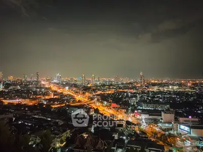 Stunning cityscape night view with illuminated skyline and vibrant urban lights.