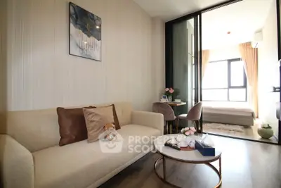 Modern living room with cozy sofa and stylish decor leading to a bright bedroom.