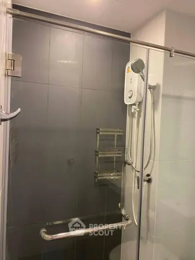 Modern bathroom with glass shower enclosure and sleek fixtures