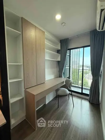Modern study room with built-in desk and shelves, large window with city view, and elegant curtains.