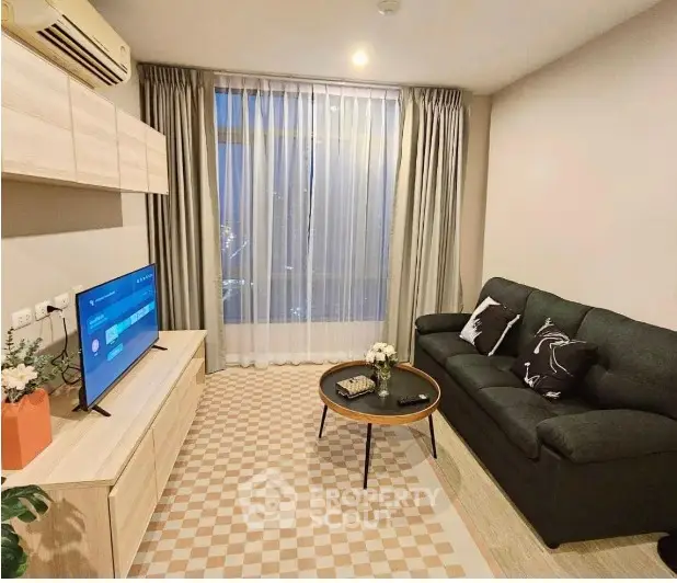 Cozy living room with modern decor and large window view