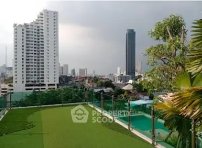 Stunning cityscape view from rooftop garden with pool and lush greenery