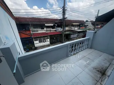 Charming balcony with urban view, perfect for relaxing and enjoying city life.